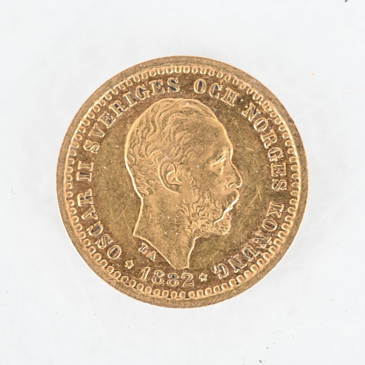 Guldmynt, 5 kronor Oscar II 1882, Sverige på auktion i Luleå, Norrbottens län hos Luleå Auktionsverk